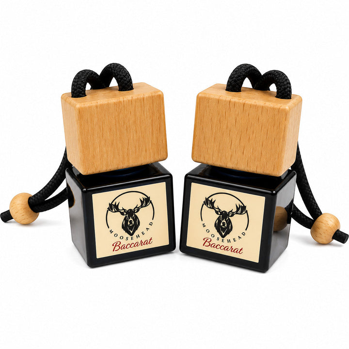 Moosehead Candles And Home Fragrances Baccarat inspired car air freshener hangers with black glass and wood caps.